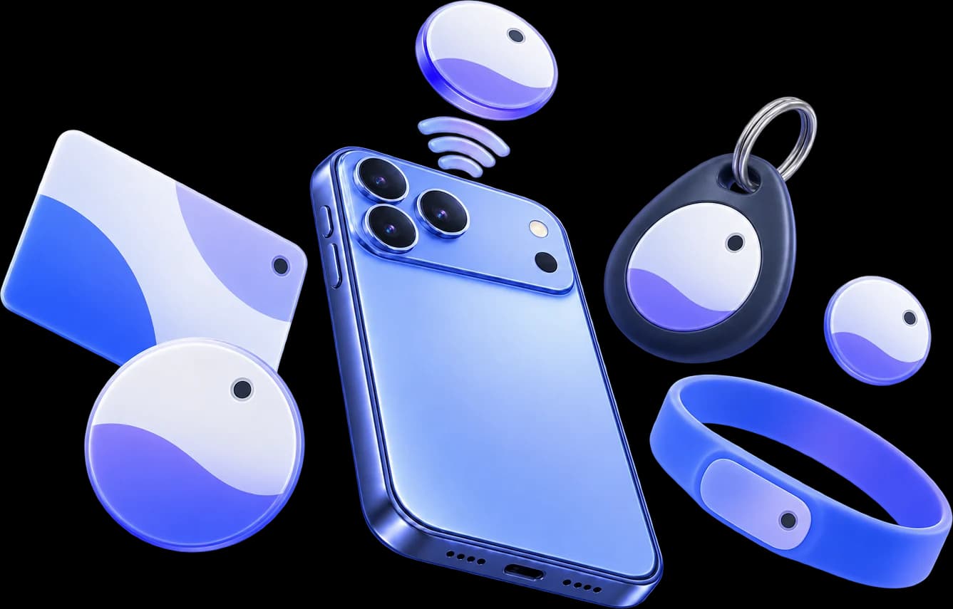 An iPhone surrounded by an NFC card, sticker, key fob and wristband